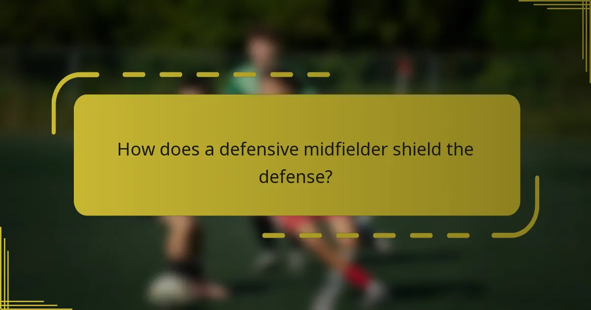 How does a defensive midfielder shield the defense?